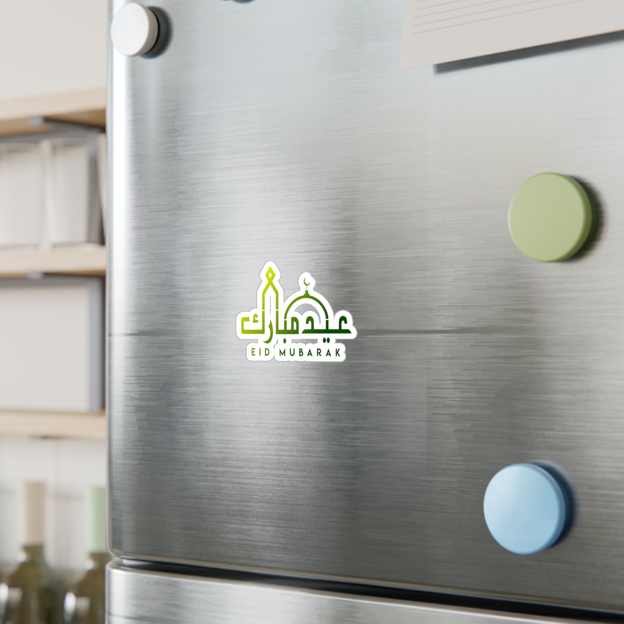 A refrigerator door with a "Medina Roots Eid Mubarak Transparent Outdoor Sticker" amidst other magnets and notes.