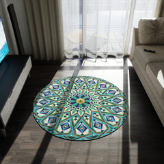 A colorful round rug with Vibrant Zellige Geometric Patterned Rug in Stunning Blue Hues on a wooden floor in a sunny, modern living room by Medina Roots.