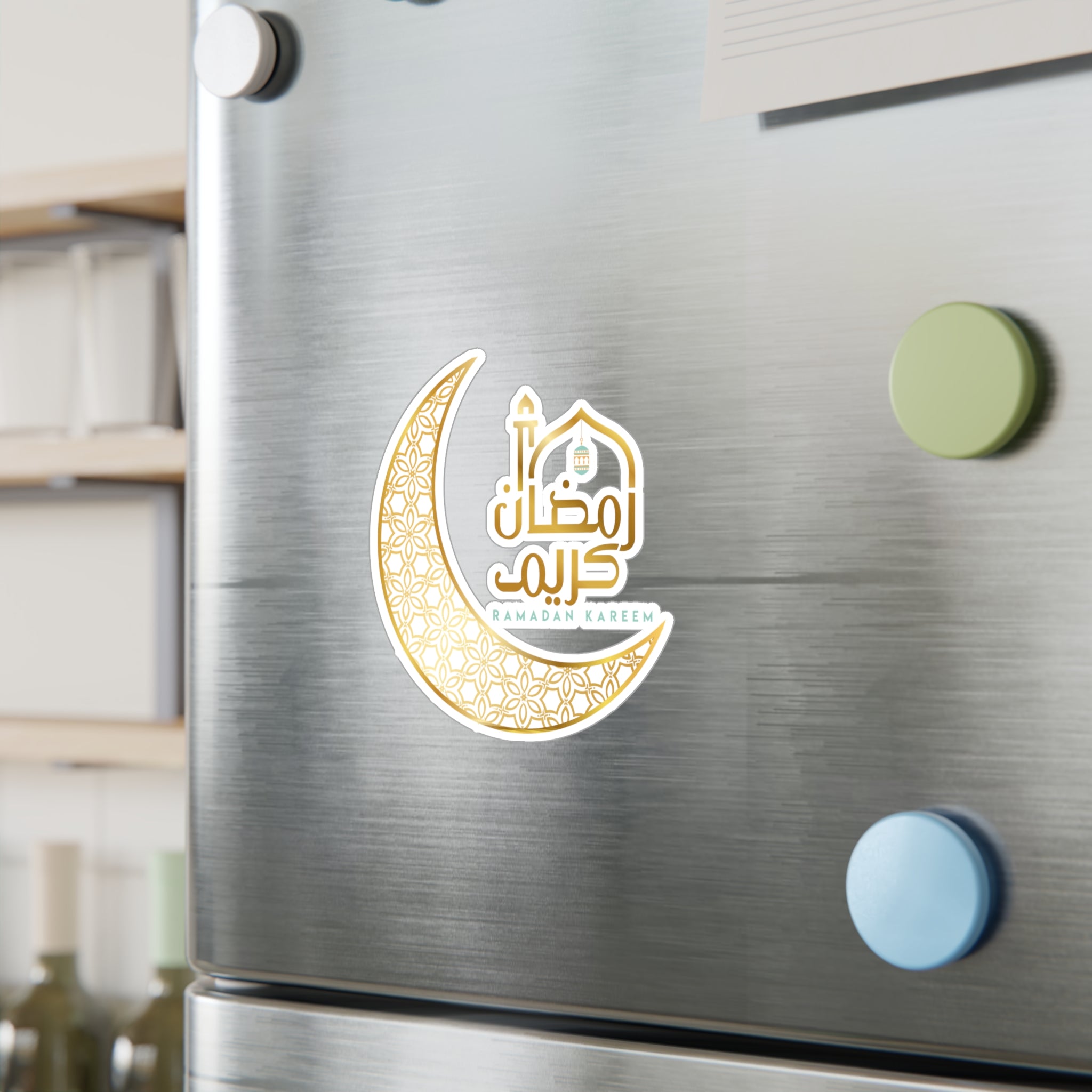 A Ramadan Kareem sticker on a refrigerator door with colorful magnets from Medina Roots.