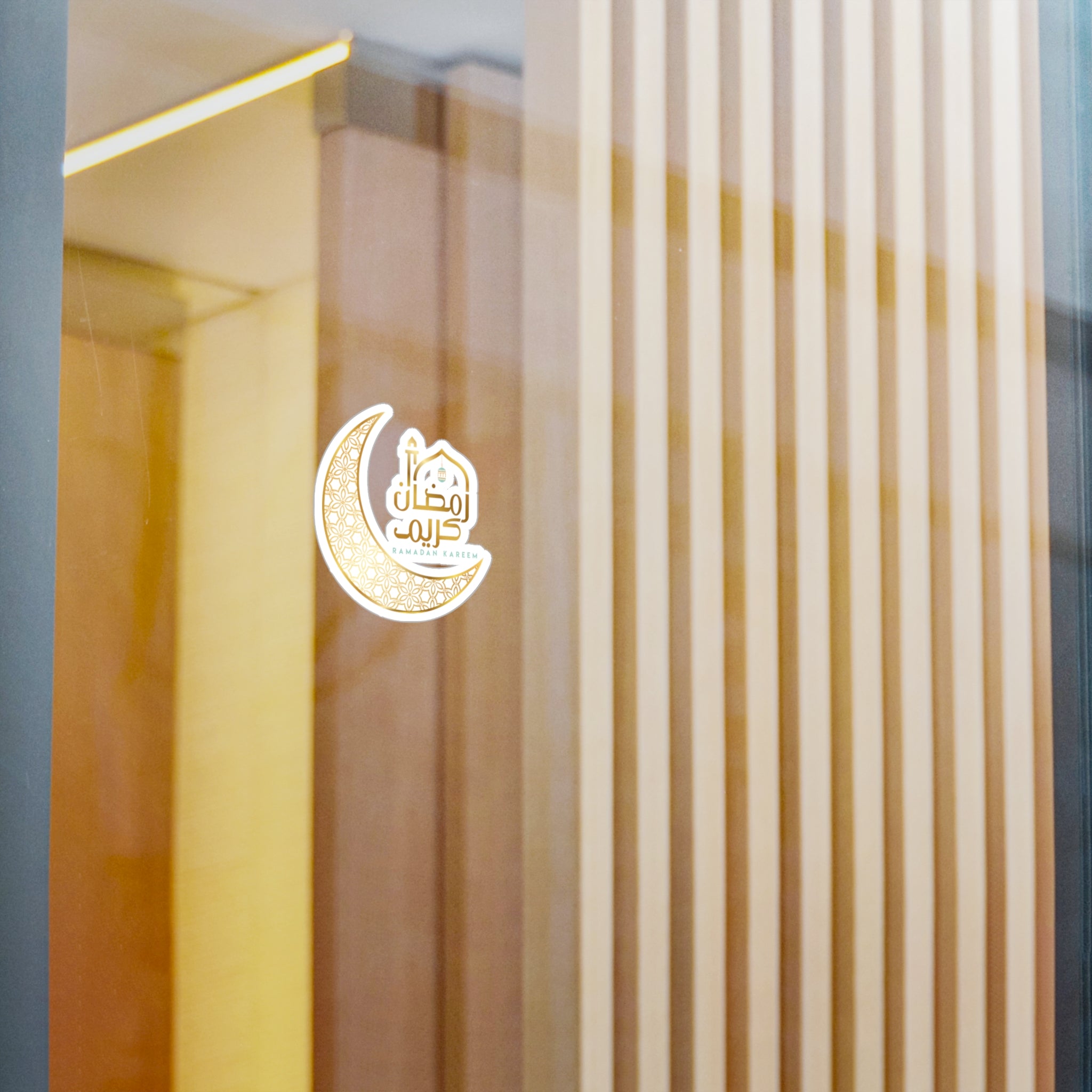 Medina Roots logo with Arabic script displayed as a sticker on a glass door in a modern interior setting, enhanced with Ramadan Kareem Transparent Outdoor Stickers decorations.