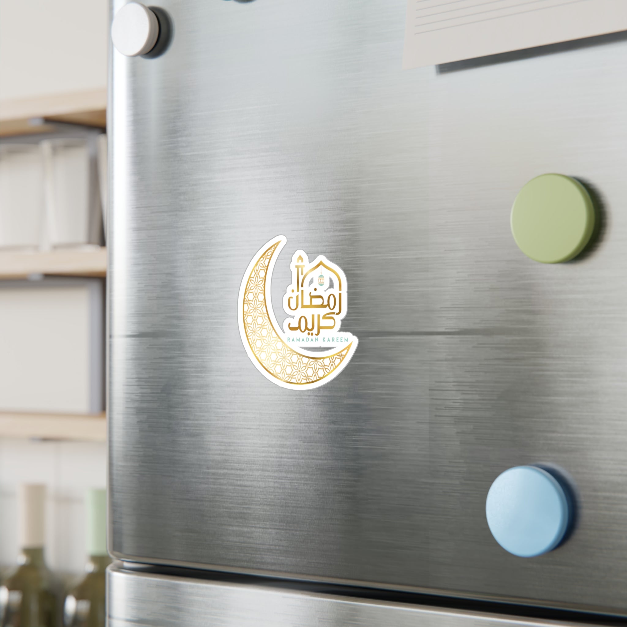 A crescent moon and star sticker with Ramadan arabic calligraphy on a Medina Roots stainless steel refrigerator door.